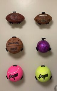 Balls on the Walls!  These handy holders keep balls organized, clean and off the floor!